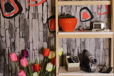 Different objects including a red glass box and Wristwatch and flowers domino Stock Photos