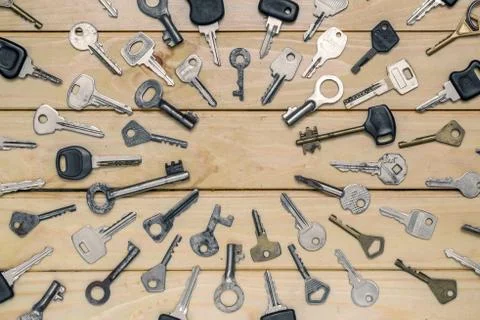 Different old keys are directed to the center top view Stock Photos