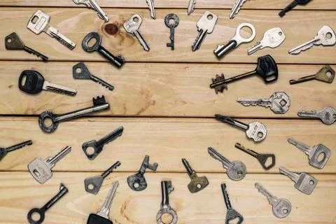Different old keys are directed to the center top view Stock Photos