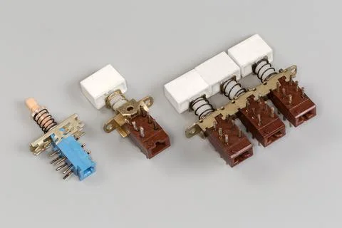 Different old outdated electrical single and modular push button switches Stock Photos