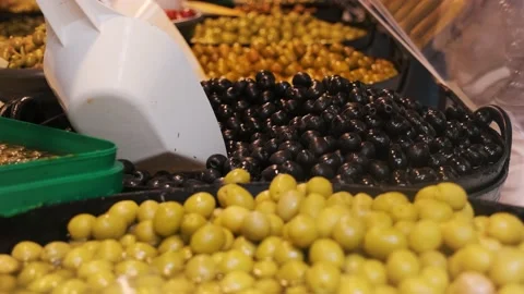 Different olives in large containers Stock Footage 220150641