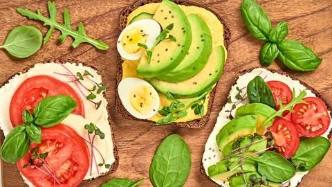 Different open sandwiches with vegetables, tomato, mozzarella. Vitamin comp.. 스톡 사진