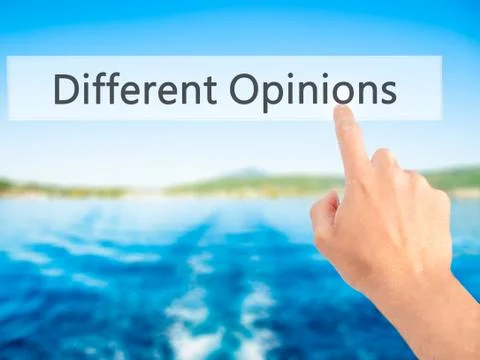 Different Opinions - Hand pressing a button on blurred background concept . B Foto stock