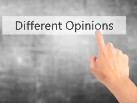 Different Opinions - Hand pressing a button on blurred background concept . B Foto stock