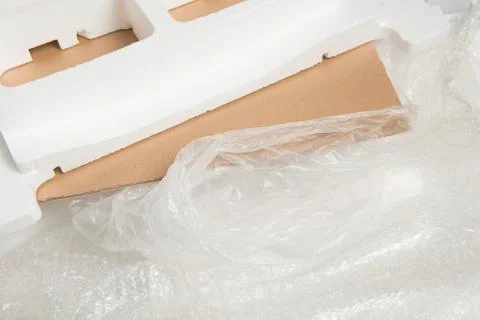 Different packaging material waste used for one item, like carton, plastic an Stock Photos