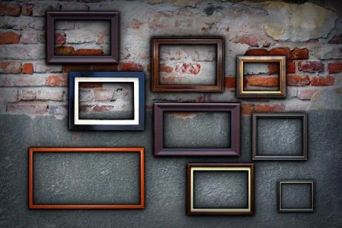 Different painting frames hanging  on cracked ancient wall Illustrazione stock