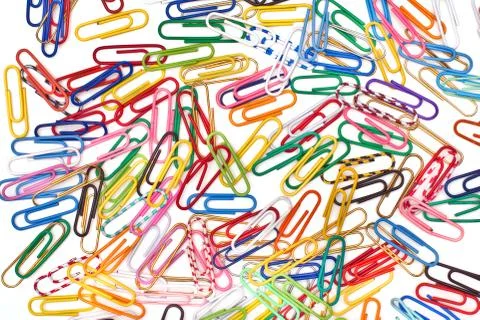 Different paper clips as background 스톡 사진