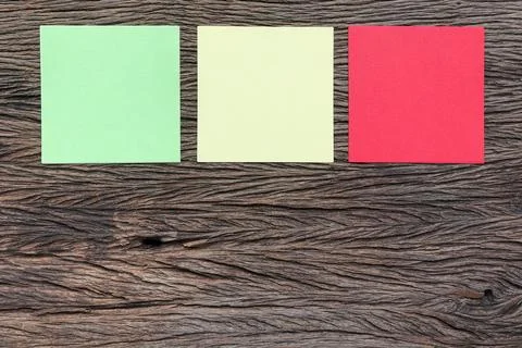 Different paper notes on wooden background. Stock Photos