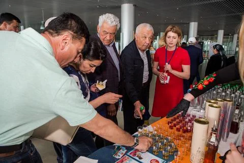 Different passengers take part in free alcohol degustation in Lviv internatio 写真素材