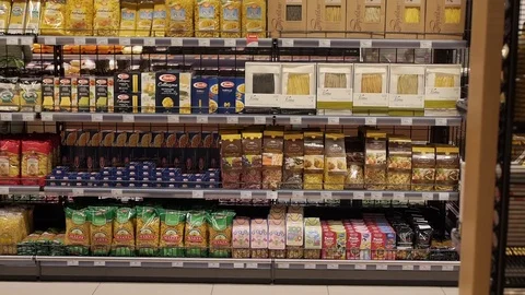 Different pasta on the shelves in the store, Camera moves from bottom to top Stock Footage 75220900