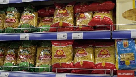 Different pasta on the shelves in the store Stock Footage 75220488
