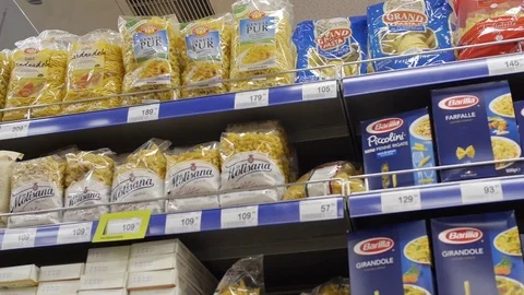Different pasta on the shelves in the store, macaroni factory, short pastas Stock Footage 75220575