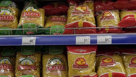 Different pasta on the shelves in the store, macaroni factory Stock Footage 75220681