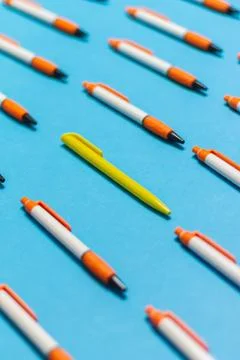 A different pen in a group of objects with a coloured background, different f Foto stock