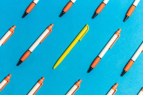 A different pen in a group of objects with a coloured background, different f Foto stock