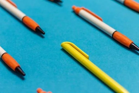 A different pen in a group of objects with a coloured background, different f Stock Photos