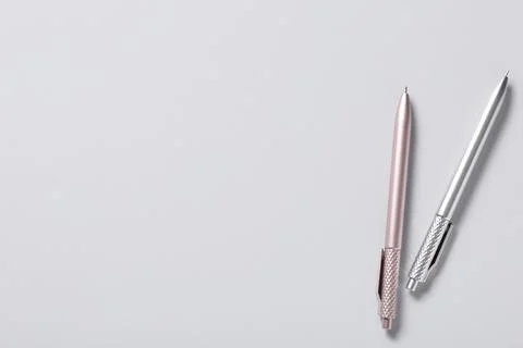 Different pens on grey background, top view Stock Photos