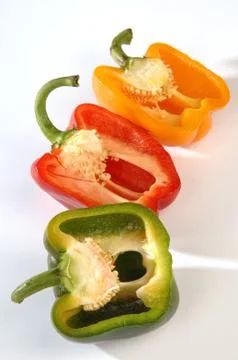 Different peppers on a gray background Stock Photos