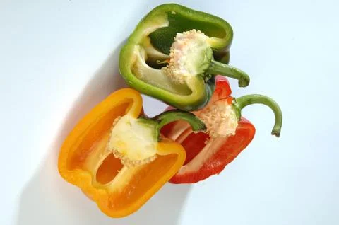Different peppers on a gray background Stock Photos