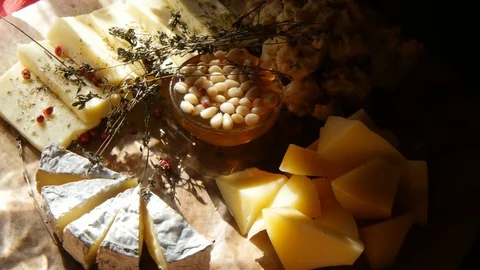 Different pieces of cheese with nuts Stock Footage 71942710