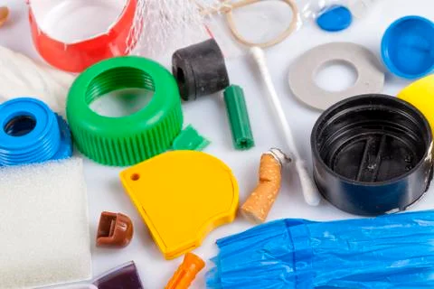 Different pieces of plastic objects that pollute the seas Stock Photos