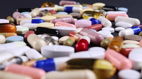 Different pills on a black background Stock Footage 170621294