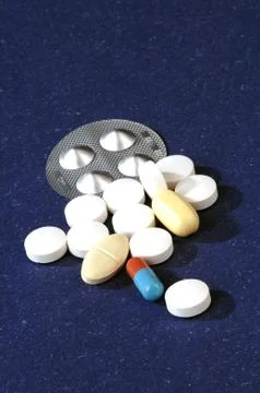 Different pills on a blue background Stock Photos