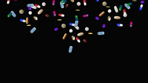 Different pills fall down on black background Stock-Footage 128604222