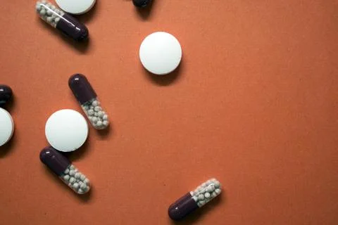 Different pills on a pink  background Stock Photos