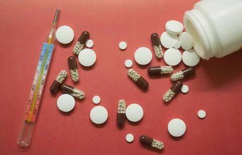 Different pills on a pink background Stock Photos