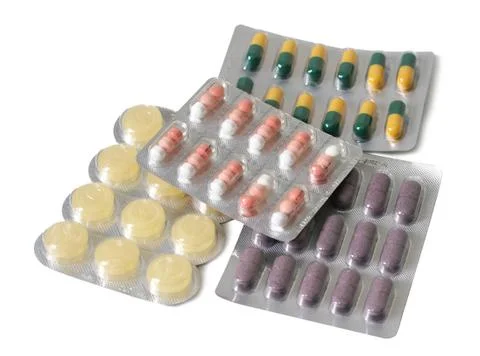 Different pills on plate Stock Photos