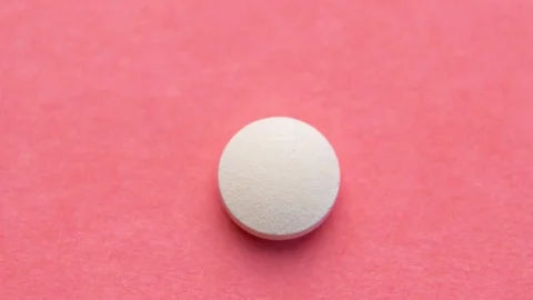 Different pills sequence. Stopmotion of few different pills on pink background Video stock 126766843