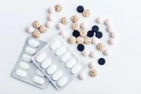 Different pills on white Stock Photos