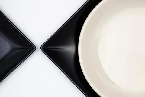 Different  plates on the white table.Top view. 库存照片