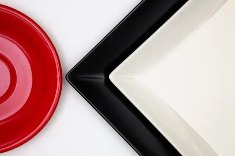 Different  plates on the white table.Top view. Stock Photos