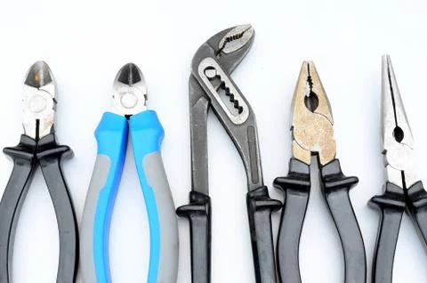 Different pliers on white background Stock Photos