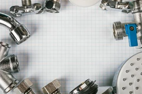 Different plumbing and tools with a notebook Foto stock