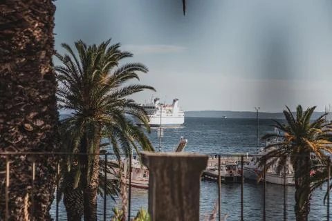 Different point of view of the split port, big white ferry approaching the ha Stock Photos