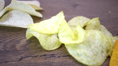 Different Potato Chips Revealed by Slow Slider Pull-Back Stock Footage 345611253