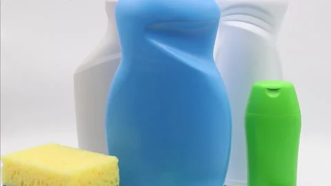 Different products and items for cleaning on the floor in the kitchen. Stock-Footage 167630732