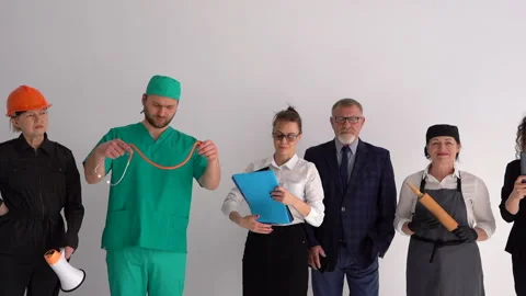Different professions concept. Group of men and women in uniform standing at Stock Footage 151914794