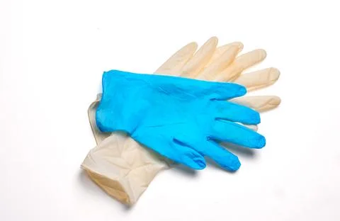 Different protective gloves on white background, top view. Stock Photos