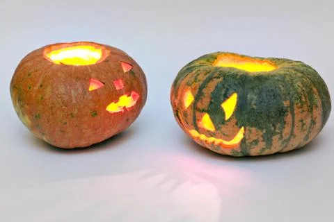 Different pumpkins for Halloween, looking at each other Stock Photos