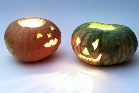 Different pumpkins for Halloween, looking at each other Stock Photos