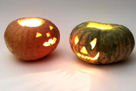 Different pumpkins for Halloween, looking at each other Stock Photos