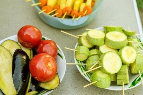 Different raw vegetables, strung on a skewer for grilling. Prepared for a pic Stock Photos