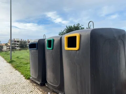 Different recycle bin of recycled materials in the park. Stock Photos