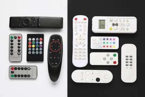 Different remote controllers on white and black background 库存照片