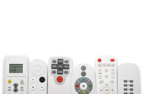 Different remote controllers on white background 库存照片