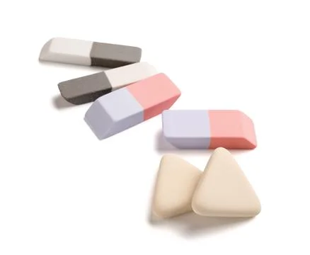 Different rubber erasers on white background Stock Photos